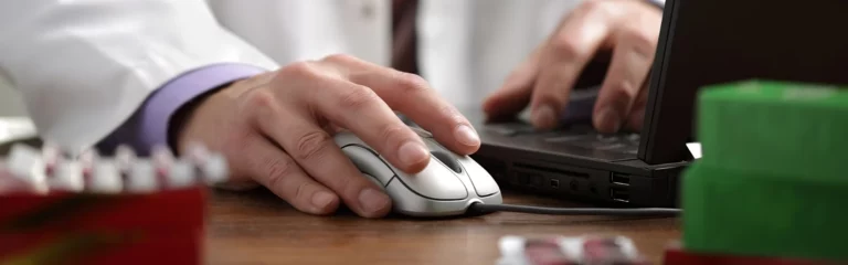 Doctor using a computer mouse